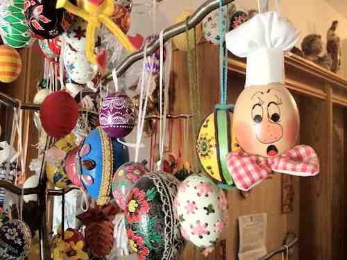 decorated eggs hanging on an Easter tree