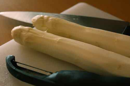 two peeled stalks of white asparagus